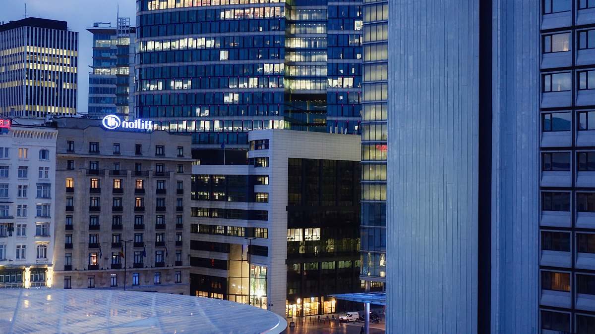 office building lighted city high rise buildings at dusk city